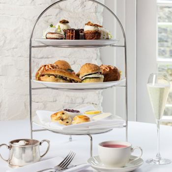Tiered plates of afternoon tea cakes and pastries