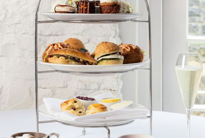 Tiered plates of afternoon tea cakes and pastries