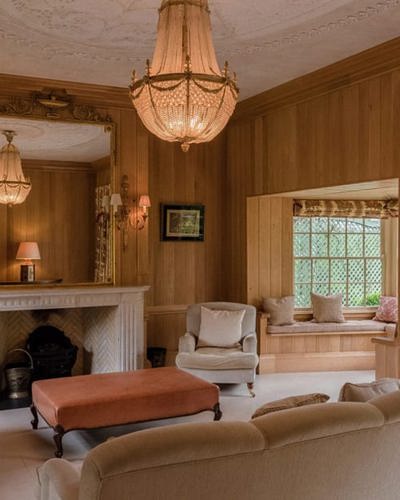 Wood panelled lounge with fireplace