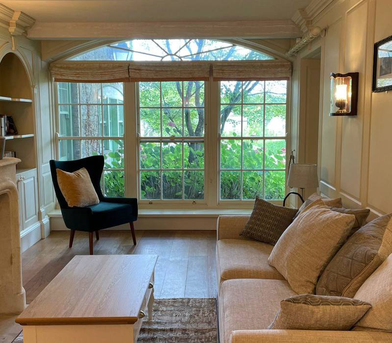 Lounge room with fireplace and garden view at Irish hotel