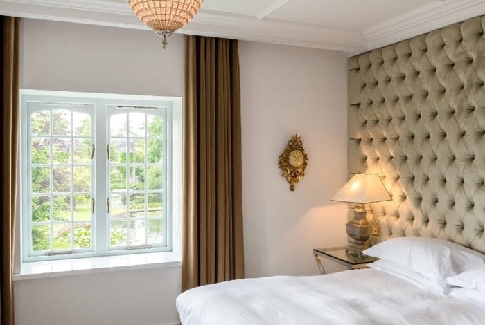Cosy simple hotel room with garden views