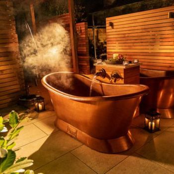 Copper outdoor bathtub and tiles floors
