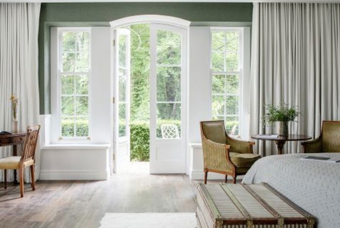 Internal view of hotel suite at luxury 5 star hotel with garden views