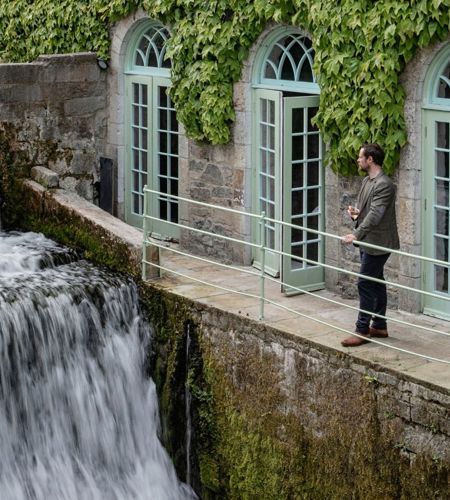 Man watches canal next to cliff at lyons 