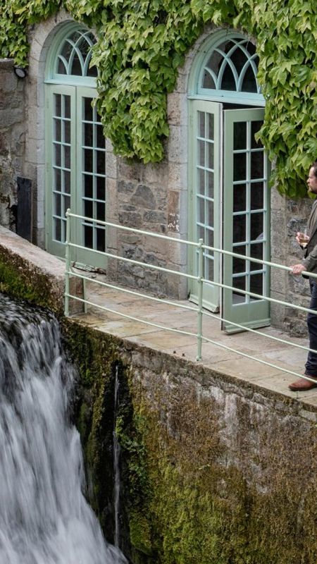 Man watches canal next to cliff at lyons 