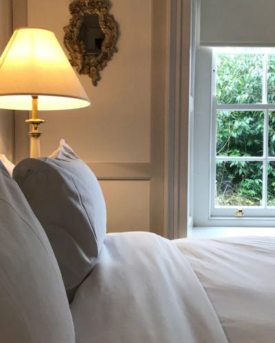 Close up view of clean linen on hotel bed