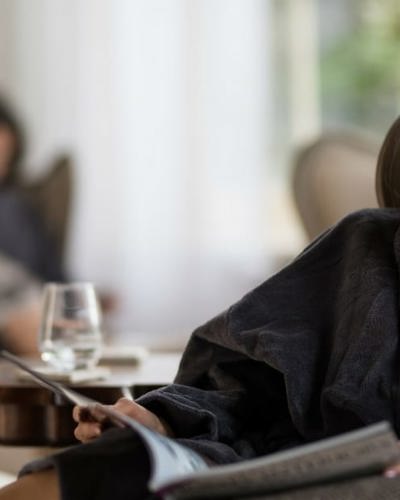 Lady enjoys day spa treatment with relaxed smile