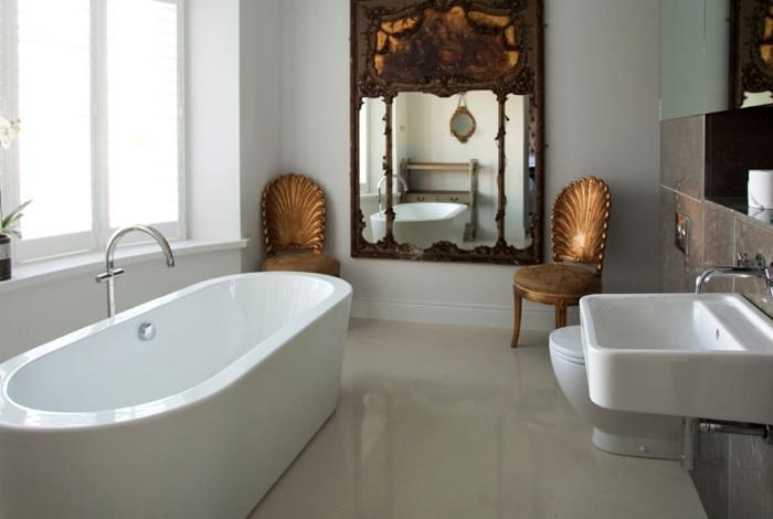 Modern spacious bathroom with large bathtub and garden view
