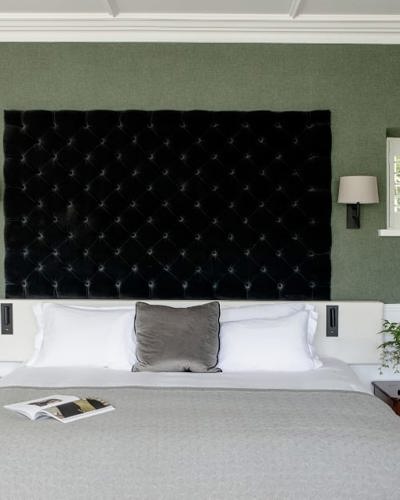 Modern comfortable hotel suite with large king size bed