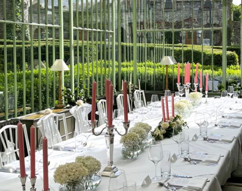 Atrium wedding dining room with candles and white tablecloth