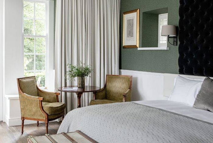 Lily Pond elegant hotel suite internal view of bed with white linen