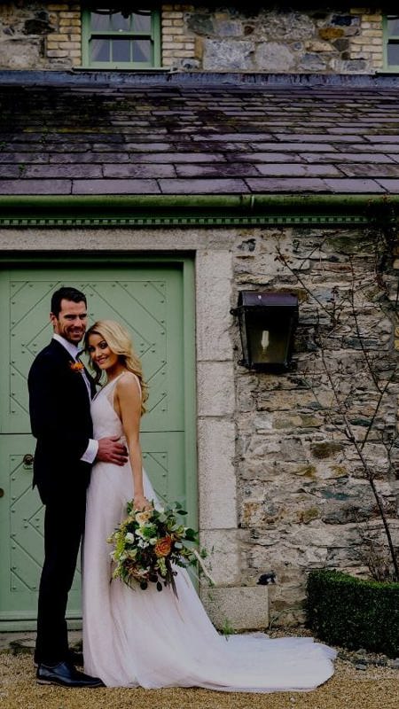 Bride and groom pose at best irish country house wedding venue