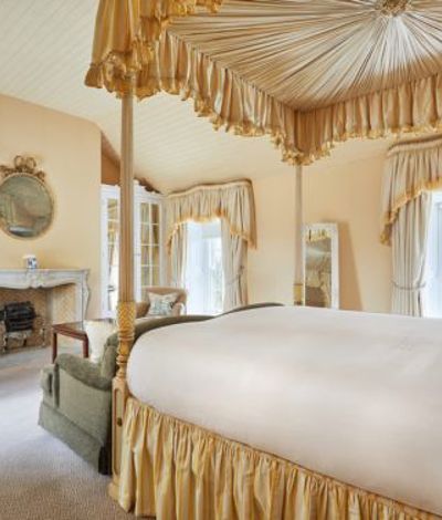 Gold themed hotel room with fireplace
