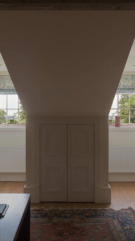 Hote suite with 2 vaulted windoes with garden views
