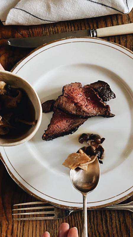 Slices of tender beef with wild mushroom sauce