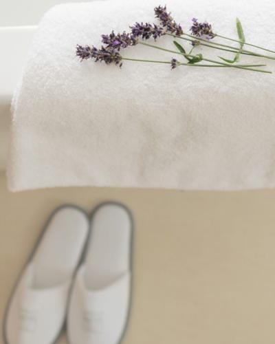 Lavendar stems on white towel