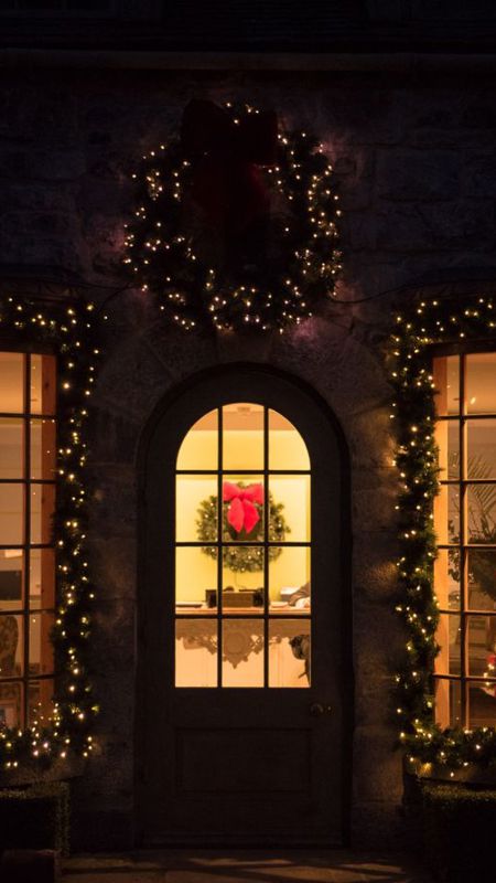 Irish cottage with christmas decoration and candles near dublin