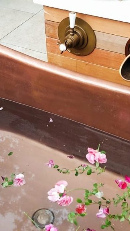 Outdoor bath with rose petals