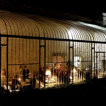NIghtime view of atrium with wedding dinner