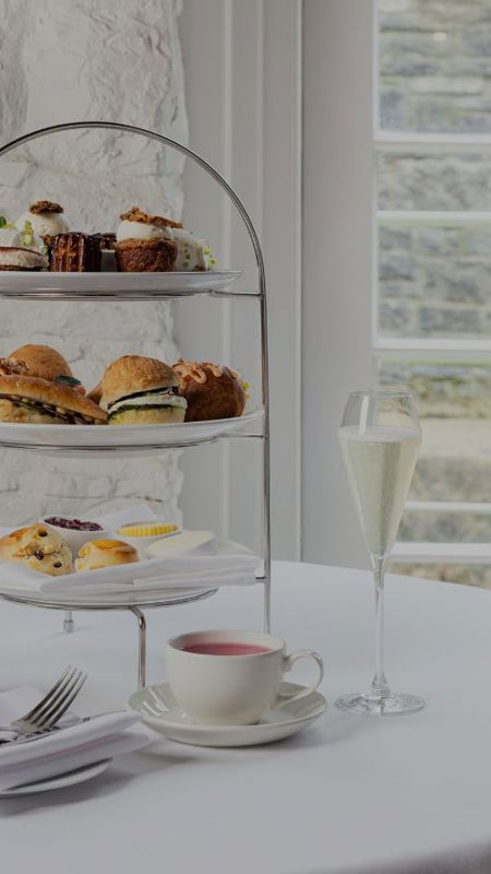 Tiered afternoon tea stand with sandwiches