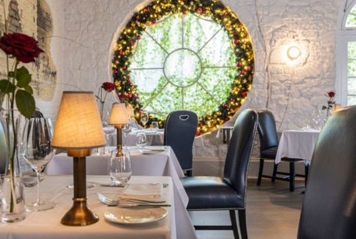 Christmas decorations in dining room at country house estate