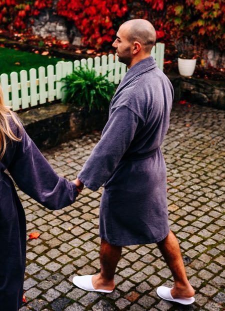 Couples walks in dressing gowns for day spa treatment