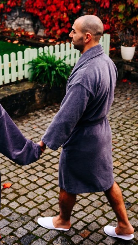 Couples walks in dressing gowns for day spa treatment