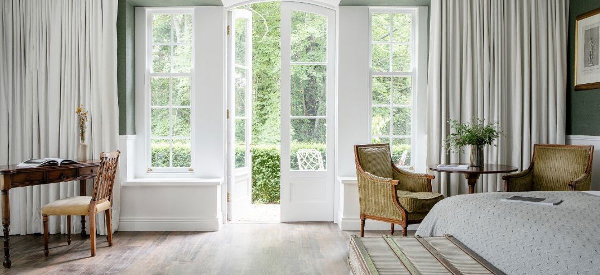 Garden View through white windows at luxury 4 star hotel